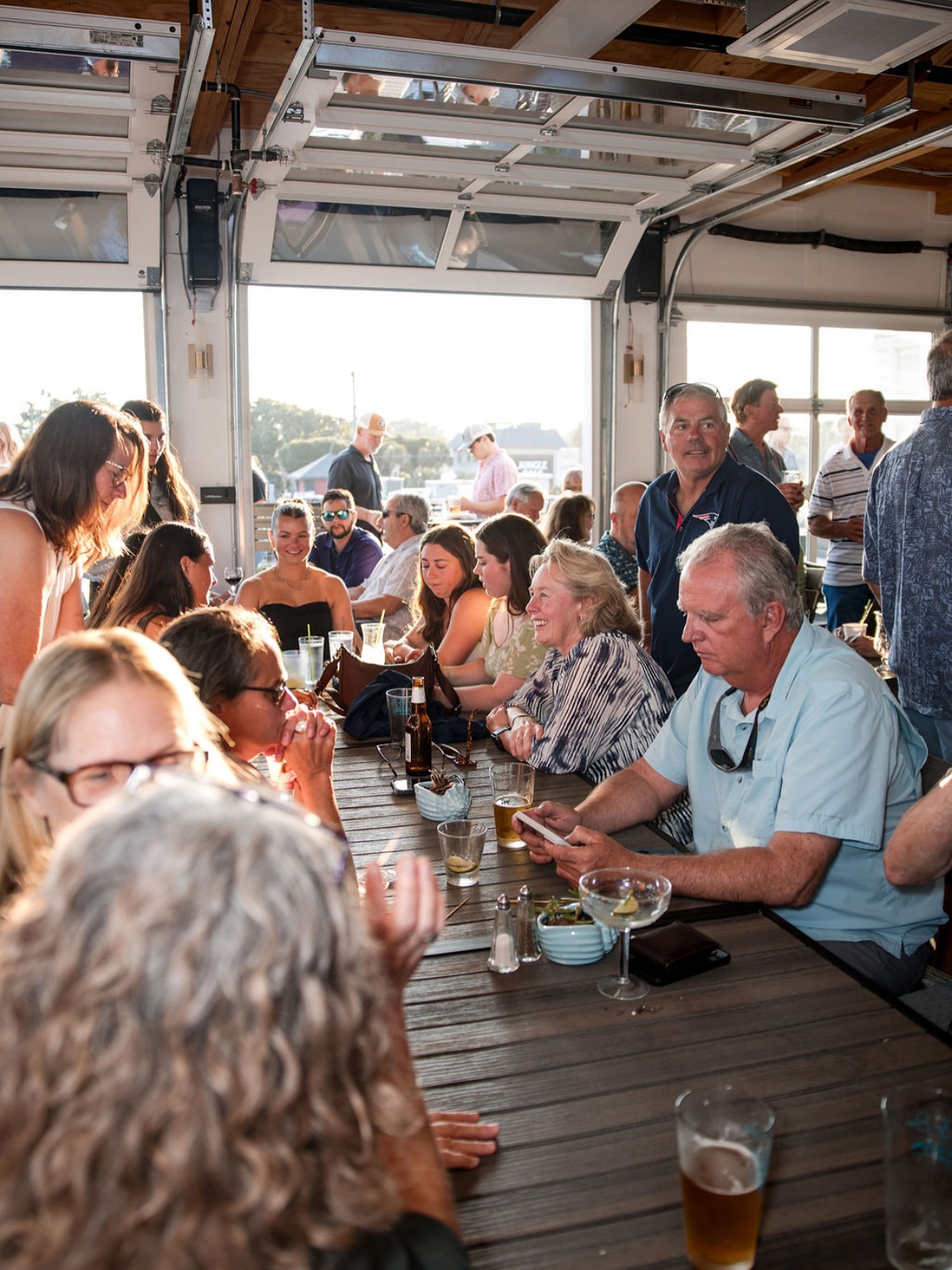 A crowded table at Lucy's Sky Bar located in Virginia Beach